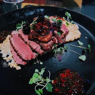 a plate of meat and vegetables