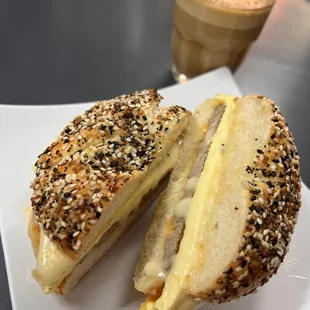 a bagel sandwich and a coffee