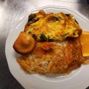an omelet with a side of oranges