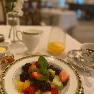 a plate of fruit salad on a table
