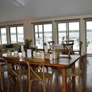 a dining room with a view of the water
