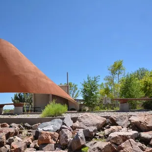 a large triangular structure in the background