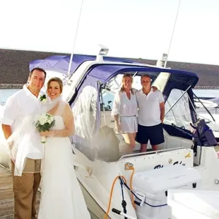 a bride and groom on a boat