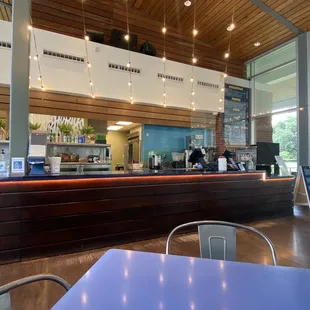 Indoor dining area w/ front counter view