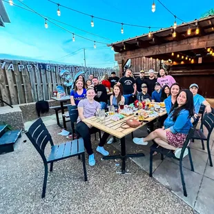 a group of people sitting around a table
