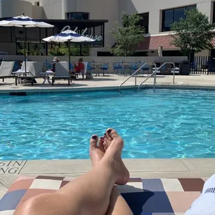 a woman's legs in the pool