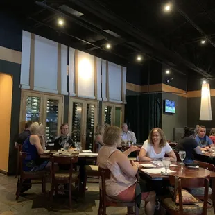 Inside view of restaurant with wine cellar along back wall