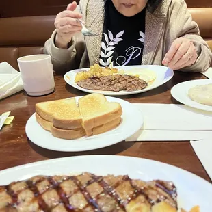 Enjoying our Steak and eggs .