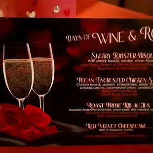 two glasses of wine and roses