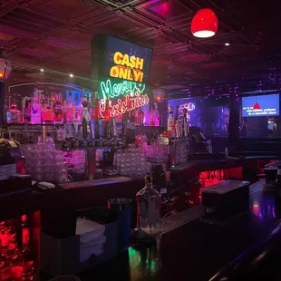 a bar with neon signs