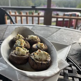 a plate of stuffed mushrooms