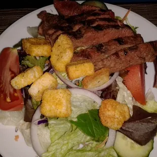 House salad - $7. Add steak - $13.50.
