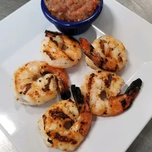 grilled shrimp with a side of salsa