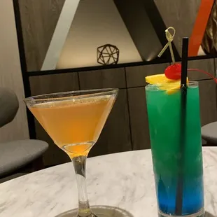 two cocktails on a table