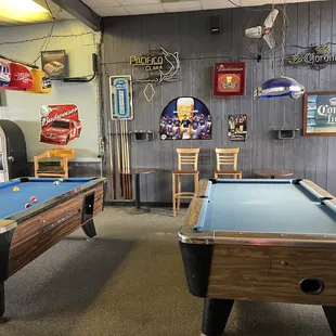 Two pool tables , juke box