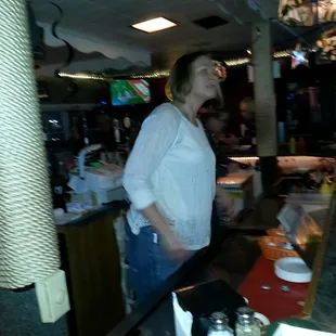 The bartender is as kind is she is beautiful