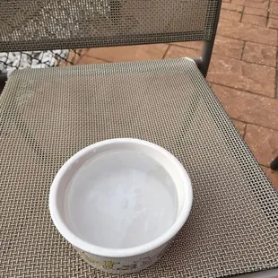 The waitress provided water for our Koko
