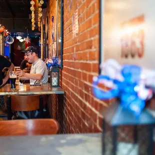 people sitting at tables in a restaurant