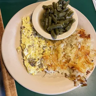 an omelet, green beans, and hash browns