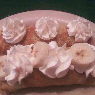 Strawberry and banana crepes with whipped cream