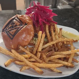 a burger and fries on a plate