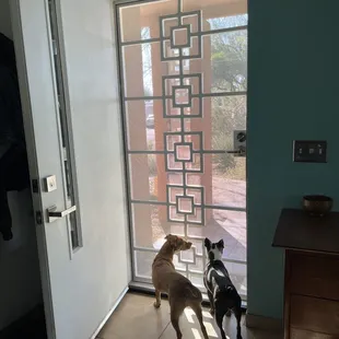 New security door with a custom square in square design to match our breeze block porch columns.