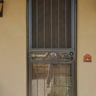 Custom built door with regular window screen and interchangeable glass panels.