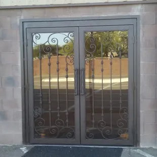 French door with glass and custom made handles.