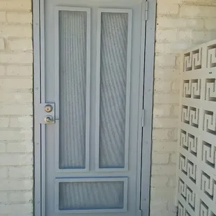 Custom designed security door powder coated by Elegant Iron