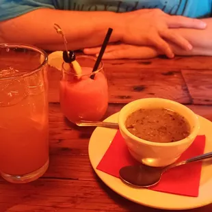 An Arnold Palmer, and a Watermelon Frose: frozen, blended watermelon, vodka, rosé and lemon, and a near-perfect cup of pork green chile.