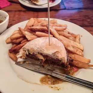 El Jefe burger: chorizo patty, pepper jack cheese, pickled red onions and green chile on a potato bun, with batter-dipped fries.
