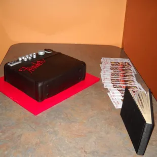 a black cake with red icing