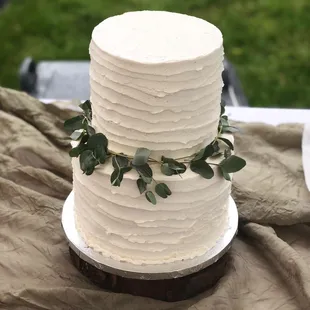 a three tiered white wedding cake