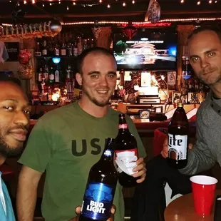 three men drinking beer