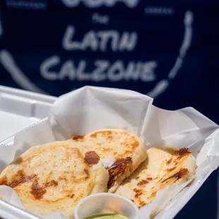 Our arepas with creamy cilantro garlic sauce.