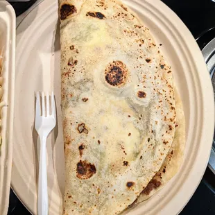 Loaded Baleada. Homemade Honduran flour tortilla, refried beans, eggs, sour cream, cheese, choice of meat, and avocado. $10.