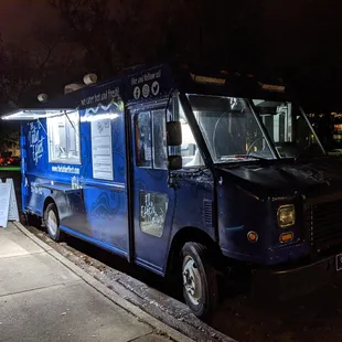 Outside The Latin Effect food truck. Front of truck and passenger side.