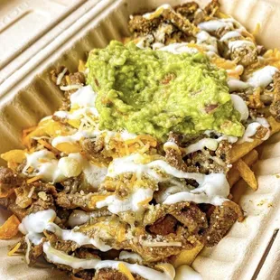 Carne Asada fries w/sour cream, guacamole, and cheese