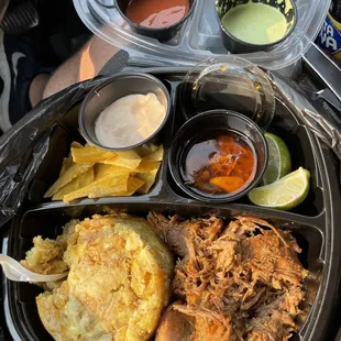 Mofongo Tradiconal(roast pork) w/plantain chips and a variety of delicious sauces.
