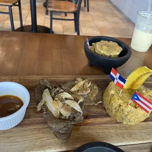 Beefsteak Mofongo , tostones, and mango smoothie .