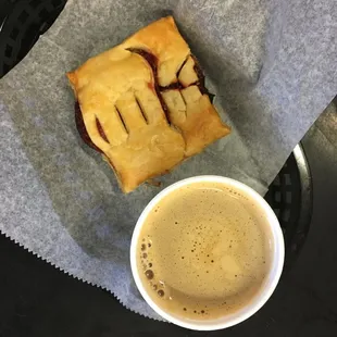 Fresh out of the oven Guava pastry and cafe con leche.