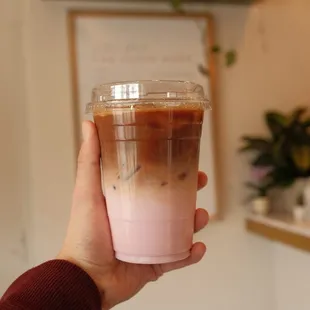 a person holding a cup of coffee