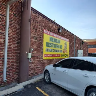 a car parked in front of a mexican restaurant