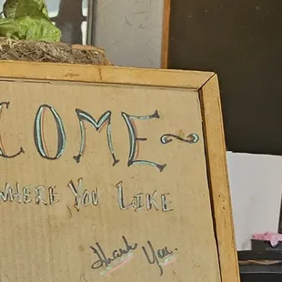 a welcome sign and a bottle of water
