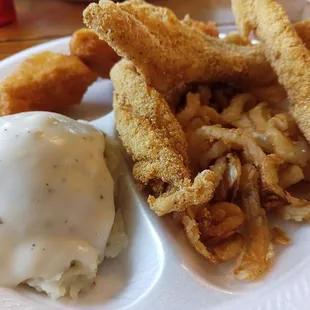 Three piece catfish with three sides (onion rings, fry bread, and mashed potatoes and gravy)