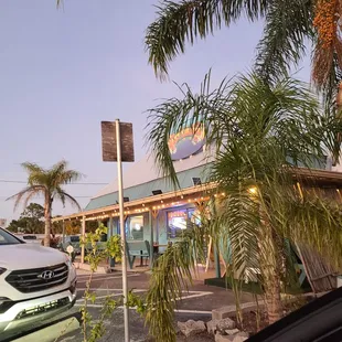 a car parked in front of a restaurant