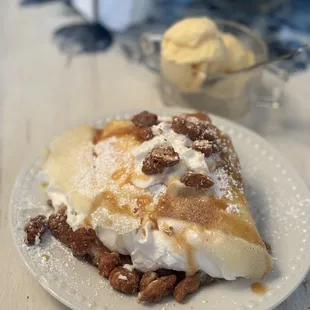 Apple pie crepe with side of vanilla ice cream