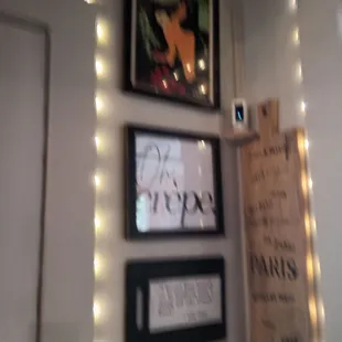 a picture of a wall with pictures and lights