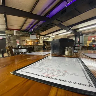 a menu on a wooden table