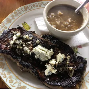 New York strip steak topped with Gorgonzola and seasoned butter served with a side of seafood gumbo